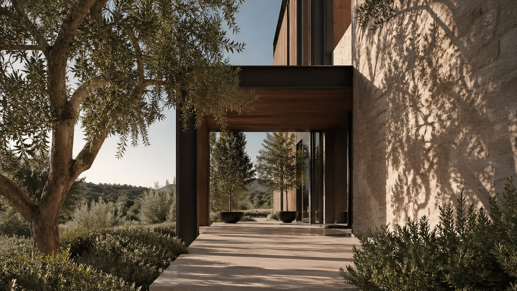 Stone and timber threshold residence set into a planted landscape